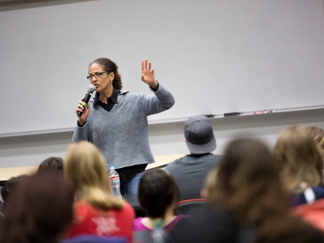 Instructor talking in front of classroom to group of students.